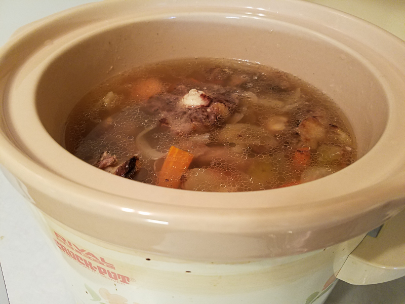 Beef oxtail bone broth simmering in the crock pot.